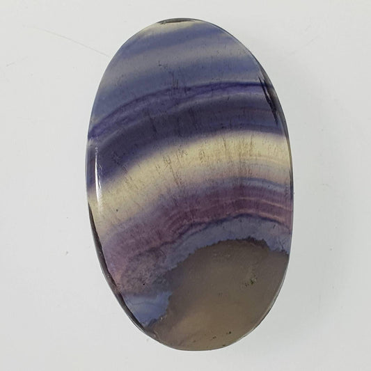 Grooved fluorite cabochon