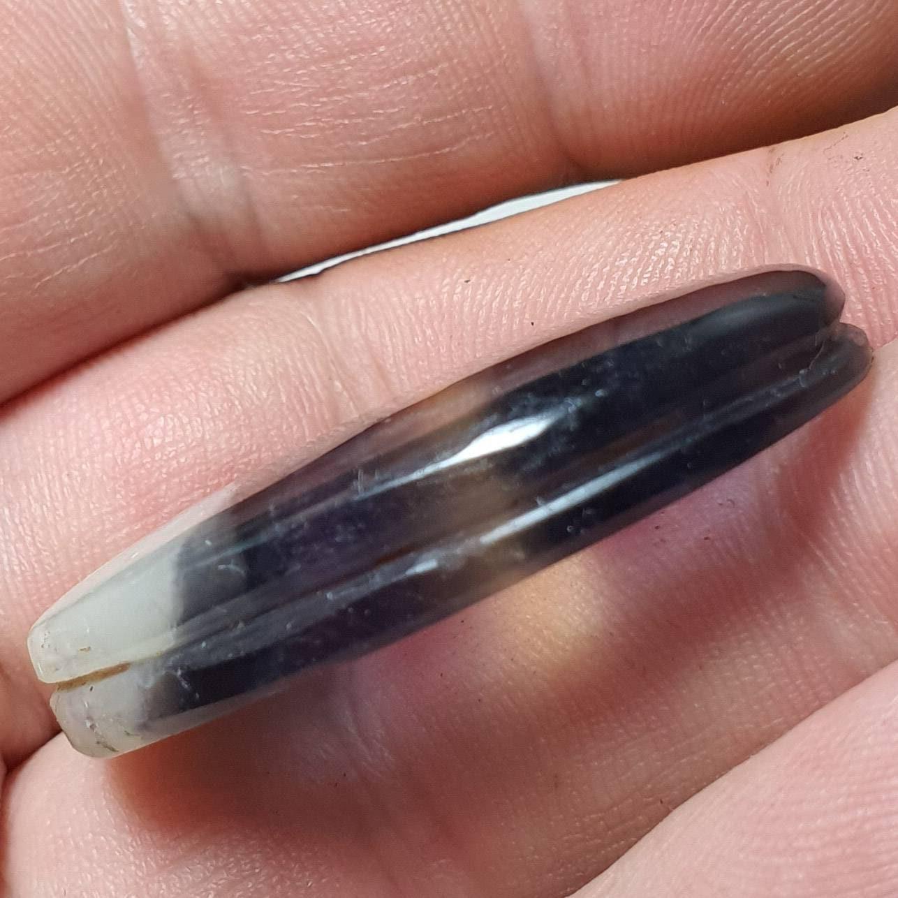 Grooved fluorite cabochon